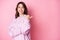 Photo of curious lady direct thumb look empty space wear knitted sweater isolated pink color background