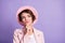 Photo of curly cheerful thoughtful cute lady dressed vintage outfit arm chin look empty space isolated purple color