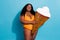 Photo of curvy big conscious lady proud her body enjoy relax hold ice cream cone advertisement  over blue color