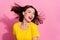 Photo of cute adorable young lady dressed yellow clothes smiling wind blowing isolated pink color background