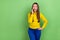 Photo of cute boss millennial brown hairstyle lady say secret wear yellow shirt isolated on green color background