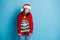 Photo of cute charming lady funny girlish look pouted plump lips hands sleeves wear santa x-mas headwear red ornamented