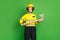 Photo of cute confident young fire lady workwear yellow helmet holding ax isolated green color background