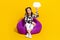 Photo of cute funky lady dressed cowskin shirt sitting bean bag holding mind cloud empty space isolated yellow color