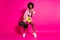 Photo of cute horned dark skin lady wear casual shirt dancing holding boom box showing hard rock gesture isolated pink