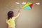 Photo of cute kid imagine flying kite. set of infographics over textured wall background