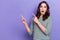 Photo of cute lady wear striped pullover shocked scared horror film advert fingers directing empty space isolated on