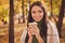 Photo of cute lovely lady stay hold cup drink coffee beaming smiling wrapped plaid blanket comforting cold chill weather