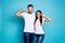 Photo of cute marriage pair showing v-sign symbols wear casual outfit isolated blue background