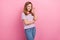 Photo of cute teenager brown hairdo girl stand wear eyewear red t-shirt jeans isolated on pink color background