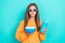 Photo of cute teenager girl brown long hair hold popcorn drink soda fanta beverage bite lips look 3d glasses isolated on