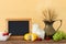 Photo of dairy products over old wooden table and pastel background. Symbols of jewish holiday - Shavuot