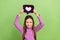 Photo of daughter demonstrate painted purple symbol instagram click like heart wear pink turtleneck  on green