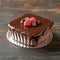 Photo Decadent chocolate cake topped with smooth ganache, irresistible dessert