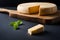 Photo delicious pieces of cheese on a dark background