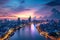 This photo depicts a city and a river at night, showcasing the vibrant lights