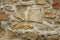 Photo of detail of castle stone wall in brown and beige tone