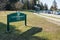 The photo displays a sign for Queen Elizabeth Park located in downtown Vancouver