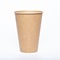 Photo of a disposable brown paper cup on a white background. Photo of a coffee cup made of recyclable materials. Empty paper