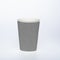 Photo of a disposable gray paper cup on a white background. Photo of a colored coffee cup made of recyclable materials. Empty