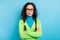 Photo of distrustful serious young schoolgirl crossed hands raise eyebrow isolated on shine blue color background