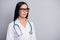 Photo of doctor girl calm look empty space wear stethoscope spectacles white uniform isolated grey color background