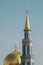 Photo of domes of Islamic church against background of blue sky