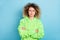 Photo of doubtful puzzled confused lady crossed hands look empty space wear green hoodie isolated pink color background