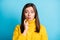 Photo of doubtful sweet adorable young lady wear yellow sweater finger chin lips pouted isolated blue color background