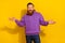 Photo of doubtful uncertain guy dressed purple sweater shrugging shoulders isolated yellow color background