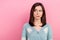 Photo of doubtful unsure woman dressed teal outfit looking empty space isolated pink color background