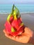 Photo Dragon fruit on the background of the sea on the beach in Thailand