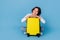 Photo of dreamy adorable lady dressed white shirt embracing baggage empty space isolated blue color background