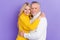 Photo of dreamy charming mature wife husband wear knitted pullovers smiling embracing isolated purple color background