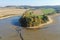 Photo of dry drained breeding pond with mud. Carps, perch, roach and other fish bodies on the shallow ground