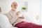 Photo of elderly man happy positive smile lying bed home happy positive smile enjoy morning cup of coffee