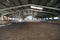 Photo of an empty indoor riding hall for horses and riders