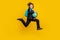 Photo of energetic little boy jump rush run hold globe wear rucksack black uniform isolated yellow color background
