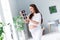 Photo of excited cheerful glad charming lovely pregnant girl mama holding showing x-ray scan icon picture checkup