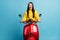 Photo of excited crazy brunette lady drive motorbike open mouth wear yellow sweater isolated blue background