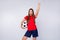 Photo of excited crazy joyful lady soccer team supporter euro 2020 hold leather ball raise fist up wear spain team