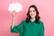 Photo of excited dreamy lady wear green shirt holding mind cloud empty space isolated pink color background