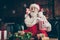 Photo of excited grey beard santa claus sit couch watch x-mas christmas television eat pop corn box amazed advent wear