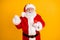 Photo of excited grey white beard hair santa claus use smartphone raise fists celebrate x-mas christmas jolly holly