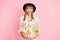 Photo of excited lady hold easter basket open mouth wear vintage headwear dotted dress isolated pink color background