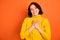 Photo of excited style casual toothy cheerful excited ecstatic girl being obviously kind while isolated with orange