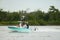 Photo of a family boating in Miami on the weekend. Shot with a telephoto lens for nice bokeh