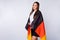 Photo of fan lady covered big germany flag coat support country world soccer league cup pretty cheerleader wear football