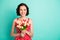 Photo of fascinating charming beautiful gorgeous woman having just received bouquet of colorful tulips while isolated