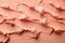 a photo featuring cosmetic smears of creamy texture on a peach - colored background